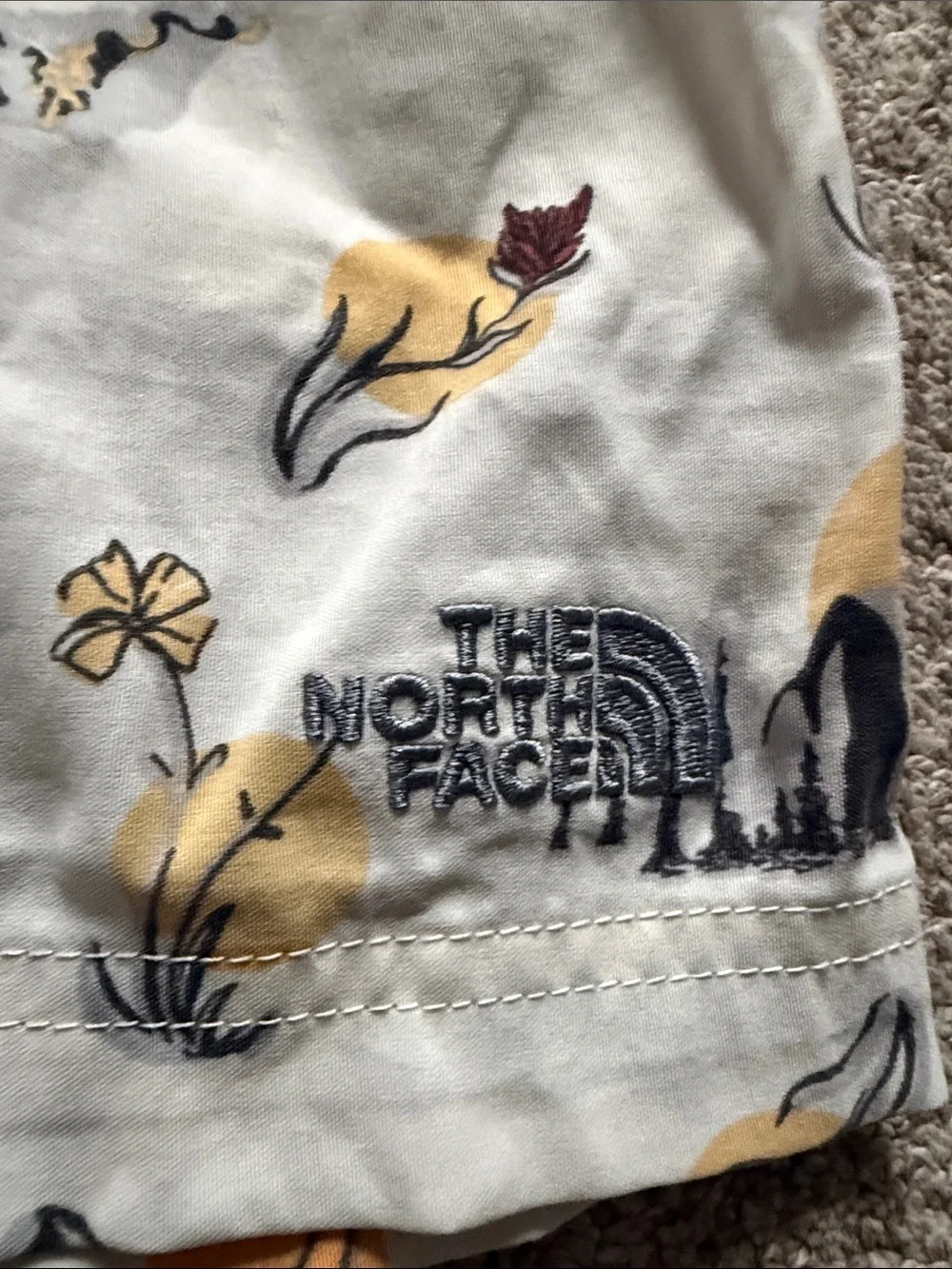 The North Face Printed Hiking Shorts — Yellow & Black Floral Motif
